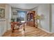 Home office featuring a wooden desk, bookcase, hardwood floors, and natural light at 3434 Fantasy Pl, Castle Rock, CO 80109
