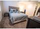 Comfortable bedroom with carpet, a queen-size bed, and walk-in closet at 5626 S Biloxi Way, Aurora, CO 80016