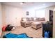 This living room is filled with plush seating and cozy carpet, perfect for relaxing at home at 5626 S Biloxi Way, Aurora, CO 80016