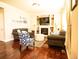 Inviting living room featuring a fireplace, hardwood floors, and comfortable sofas at 5626 S Biloxi Way, Aurora, CO 80016