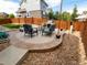 Cozy backyard patio with comfortable seating and outdoor grill, ideal for entertaining at 5626 S Biloxi Way, Aurora, CO 80016