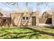 Spacious backyard featuring a well-maintained lawn, garage and privacy fence, great for outdoor activities at 1061 Adams St, Denver, CO 80206