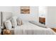 Bedroom with cozy bed, artwork, and a glimpse into a bathroom, creating a comfortable and inviting personal space at 1061 Adams St, Denver, CO 80206