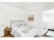 Bright bedroom with a comfy bed, neutral decor, and an ensuite bathroom provides relaxation at 1061 Adams St, Denver, CO 80206