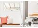 Inviting living area with wooden bench, decorative pillows, and a sunny window offering a cozy spot to relax at 1061 Adams St, Denver, CO 80206