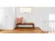 Inviting area with wooden bench and decorative pillows, enhancing its charm and comfort with wooden floors at 1061 Adams St, Denver, CO 80206