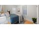 Cozy bedroom with wood floors, ample natural light from two windows, and neutral decor, creating a serene retreat at 529 E 14Th Ave # 10, Denver, CO 80203
