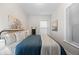Comfortable bedroom with soothing wall art, wood floors, and soft natural light filtering through the window for a peaceful ambiance at 529 E 14Th Ave # 10, Denver, CO 80203