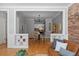 Open-concept dining area leading to the kitchen, featuring hardwood floors and modern lighting at 529 E 14Th Ave # 10, Denver, CO 80203