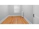Bright, versatile room with wood floors, ample natural light, and radiator offers flexible use for living, office, or bedroom at 529 E 14Th Ave # 10, Denver, CO 80203