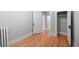 Spacious, bright room with hardwood floors, radiator, and classic trim offers flexible use as bedroom, office, or storage at 529 E 14Th Ave # 10, Denver, CO 80203