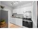 Bright, updated kitchen with white cabinetry, stainless steel appliances, and subway tile backsplash for a clean and modern look at 529 E 14Th Ave # 10, Denver, CO 80203