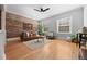 Comfortable living room with a brick wall, hardwood floors, and an open layout at 529 E 14Th Ave # 10, Denver, CO 80203