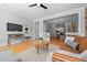 Spacious living room flows into a dining area and features hardwood floors and an open layout at 529 E 14Th Ave # 10, Denver, CO 80203