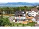 Stunning exterior view of the property featuring spacious balconies and outdoor living areas, set against a scenic backdrop at 8357 W 68Th Ln, Arvada, CO 80004