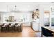 Bright open kitchen with a large island, stainless steel appliances and hardwood flooring at 8357 W 68Th Ln, Arvada, CO 80004