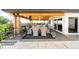 Spacious outdoor patio with dining area, offering a serene view and ample space for entertaining and relaxation at 8357 W 68Th Ln, Arvada, CO 80004