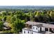 Enjoy outdoor living on this rooftop deck with views of the lush surrounding landscape and cityscape beyond at 8357 W 68Th Ln, Arvada, CO 80004