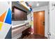 Welcoming entryway with colorful geometric art, built in desk space and storage at 1233 N Ogden St # 610, Denver, CO 80218