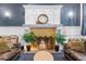 Close-up of a luxurious fireplace with a mantel and flanking sofas at 1233 N Ogden St # 610, Denver, CO 80218