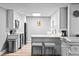 Well lit kitchen features white cabinets and stainless steel appliances at 1233 N Ogden St # 610, Denver, CO 80218