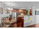 The kitchen and dining area features wood floors, updated appliances, and cabinets for a sleek look at 1233 N Ogden St # 610, Denver, CO 80218
