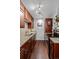 Galley kitchen has granite counters, stainless appliances and wood cabinets at 1233 N Ogden St # 610, Denver, CO 80218
