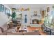 Inviting living room features a cozy fireplace, wood floors, and stylish decor throughout the space at 1233 N Ogden St # 610, Denver, CO 80218