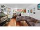 Open floor plan between the living room and kitchen create an inviting space with wood floors at 1233 N Ogden St # 610, Denver, CO 80218
