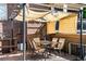 Cozy patio area includes outdoor dining set and protective sun-shading at 1233 N Ogden St # 610, Denver, CO 80218