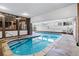Bright indoor pool, with natural light, lounge chairs and stair entry at 1233 N Ogden St # 610, Denver, CO 80218