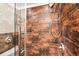 Modern shower features bronze fixtures, including rainfall shower head and wall tiles at 1233 N Ogden St # 610, Denver, CO 80218