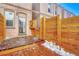 Enclosed wooden back deck with private entrance and room for relaxing, grilling or entertaining at 707 27Th St, Denver, CO 80205