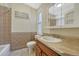Bathroom featuring decorative tile work, vanity, and bathtub at 707 27Th St, Denver, CO 80205