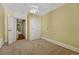 Cozy bedroom featuring neutral walls, ceiling fan, carpet and access to the next room at 707 27Th St, Denver, CO 80205