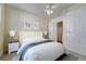 Staged bedroom with a tufted headboard and bedside tables at 707 27Th St, Denver, CO 80205