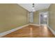 Dining room with hardwood floors, neutral paint, bright window, and ceiling fan at 707 27Th St, Denver, CO 80205
