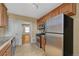Traditional kitchen with stainless steel appliances, tile flooring, and wood cabinetry at 707 27Th St, Denver, CO 80205