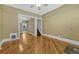 Bright living room featuring hardwood floors, neutral paint, and views to the kitchen area at 707 27Th St, Denver, CO 80205
