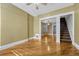 Bright living room featuring hardwood floors, neutral paint, and views to the stairway at 707 27Th St, Denver, CO 80205