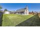 Expansive backyard featuring a lush lawn, privacy fence, and a detached storage shed at 7814 W Ontario Pl, Littleton, CO 80128