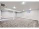 Spacious finished basement offering ample room for recreation or storage with carpeted floors at 7814 W Ontario Pl, Littleton, CO 80128