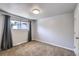 Bedroom featuring a window, neutral walls, soft carpet, and a closet for storage at 7814 W Ontario Pl, Littleton, CO 80128