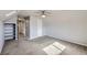 Cozy bedroom with a built-in bookshelf and direct access to a private bathroom at 7814 W Ontario Pl, Littleton, CO 80128
