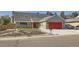 Charming single-Gathering home with brick accents, a red garage door, and a well-maintained front yard at 7814 W Ontario Pl, Littleton, CO 80128