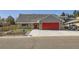 Charming single-Gathering home with brick accents, a red garage door, and a well-maintained front yard at 7814 W Ontario Pl, Littleton, CO 80128