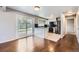 Eat-in kitchen featuring stainless steel appliances, granite counters and light wood floors at 7814 W Ontario Pl, Littleton, CO 80128