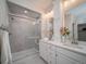 Modern bathroom with glass-enclosed shower and double sink vanity with white cabinets at 21947 E 51St Dr, Aurora, CO 80019