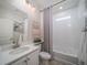 Stylish bathroom featuring a vanity with a white countertop and a shower-tub combo at 21947 E 51St Dr, Aurora, CO 80019