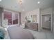 Comfortable bedroom with window, dresser and chair offering a relaxing retreat at 21947 E 51St Dr, Aurora, CO 80019